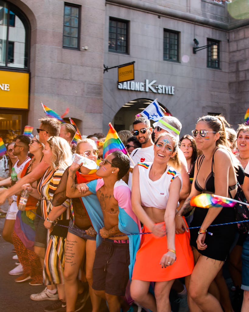 Exciting LGBTQ+ pride parade filled with energy and rainbow colors, celebrating diversity in Stockholm.